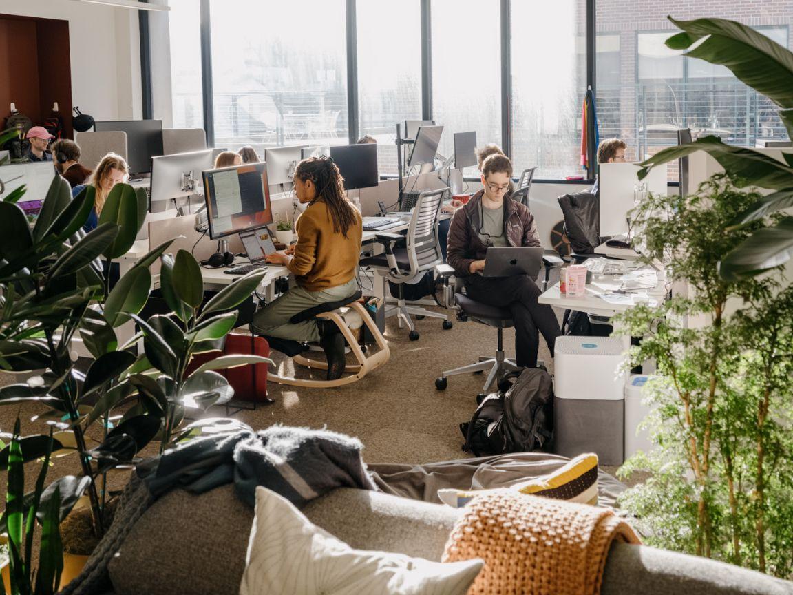 Team members in open, sunlit office